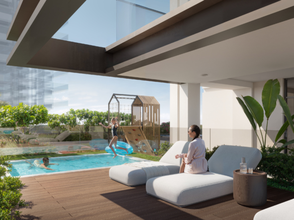Buitenzwembad met zonnedek en cabanas bij AUREL1A Residence Dubai Sports City