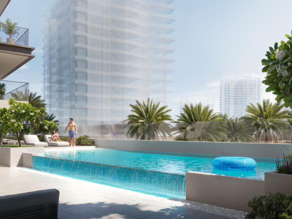 Buitenzwembad met zonnedek en cabanas bij AUREL1A Residence Dubai Sports City
