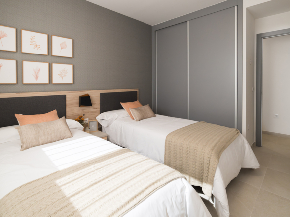 Tweede slaapkamer met twee eenpersoonsbedden geschikt voor gasten of kinderen