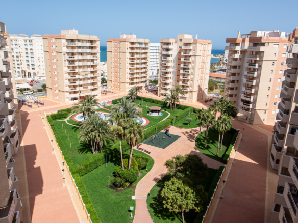 Buitenruimte met gemeenschappelijk zwembad in Puerto Mar