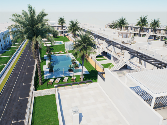Aerial view of a modern white resort with palm trees, green lawns, rectangular pools, and walkways between buildings.