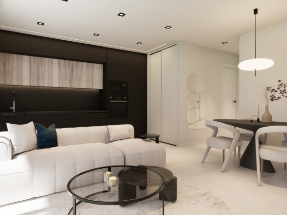 Modern open-concept living space: white sectional sofa, black kitchen cabinets, and a round dining table with beige chairs.