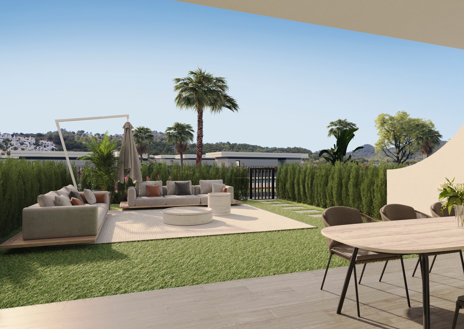 Impressie van een overdekt terras met eethoek, privétuin en loungeset bij nieuwbouw in La Manga Club