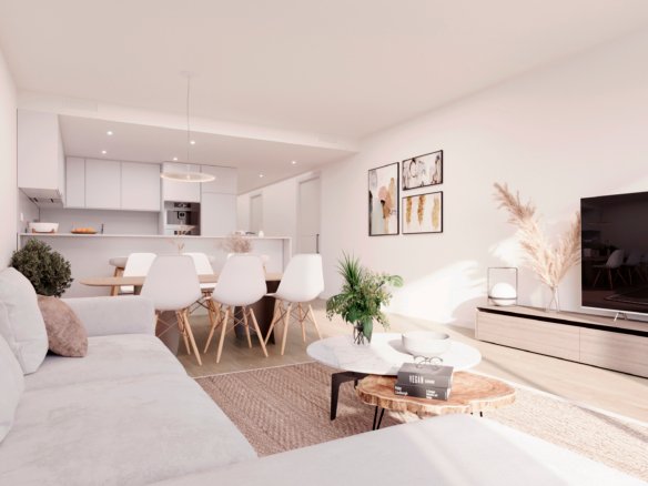 Interieurimpressie van een zithoek met tv-meubel en zicht op de open keuken bij nieuwbouw in La Manga Club