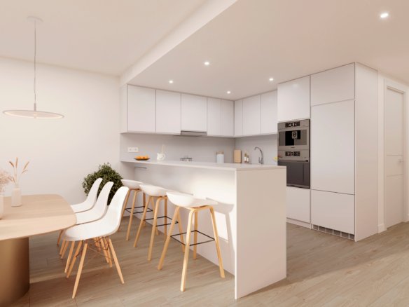 Interieurimpressie van een witte keuken met schiereiland, barkrukken en inbouwapparatuur bij nieuwbouw in La Manga Club