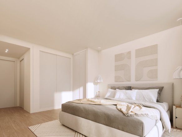 Interieurimpressie van een hoofdslaapkamer met tweepersoonsbed en witte inbouwkast bij nieuwbouw in La Manga Club
