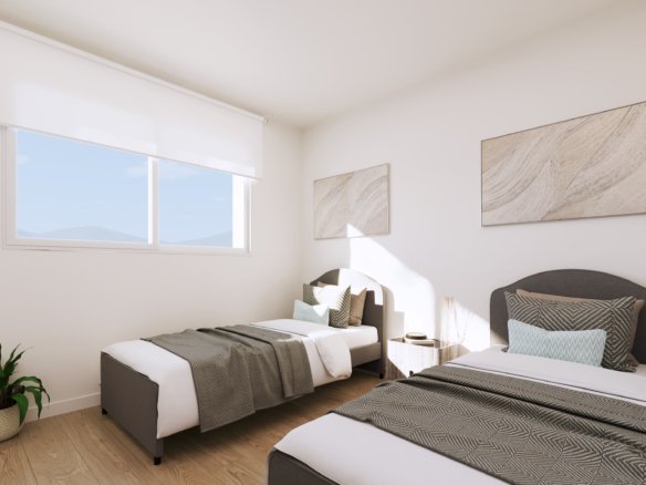 Interieurimpressie van een slaapkamer met twee eenpersoonsbedden en een breed raam bij nieuwbouw in La Manga Club