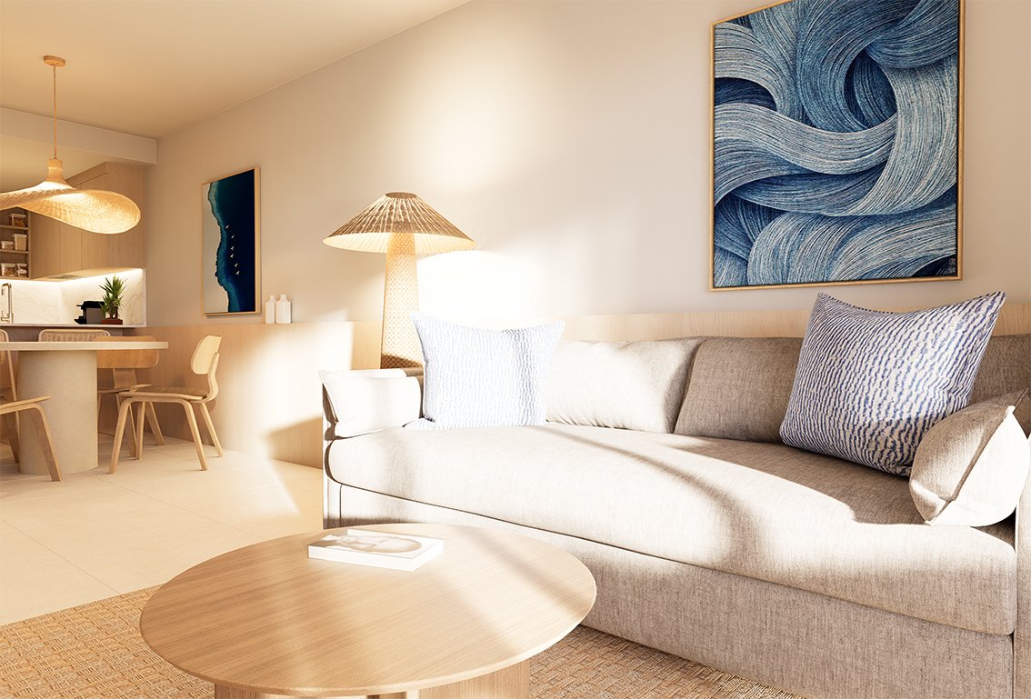 Moderne woonkamer met een bank, salontafel en kunst aan de muur.