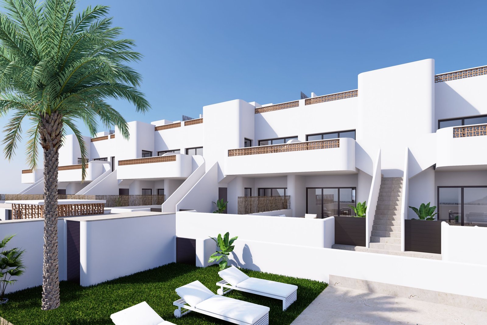 Moderne appartementen met witte gevels en een groene tuin.