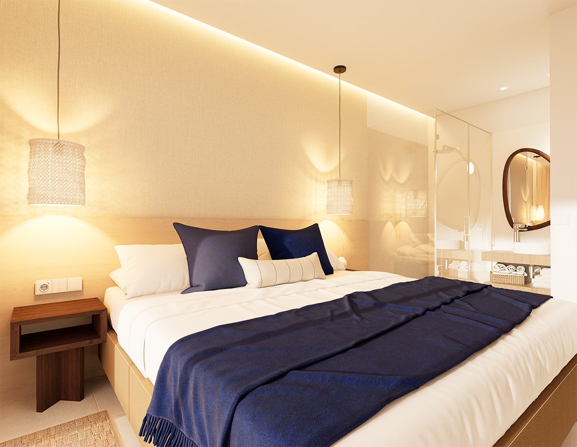 Slaapkamer met een bed en een glazen badkamerwand.