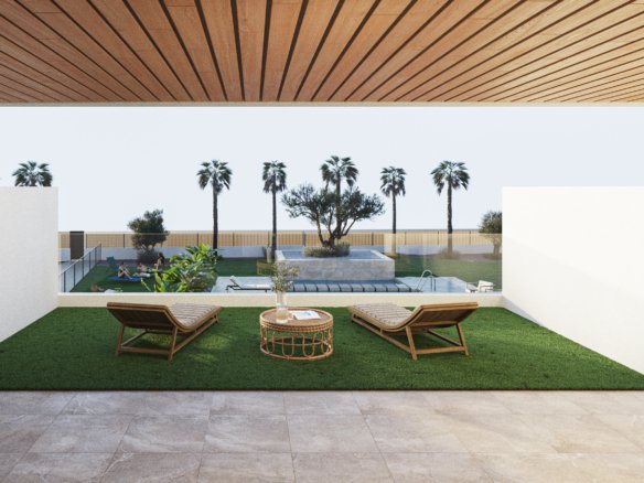 Buitenruimte met ligstoelen, gras en zwembad op de achtergrond