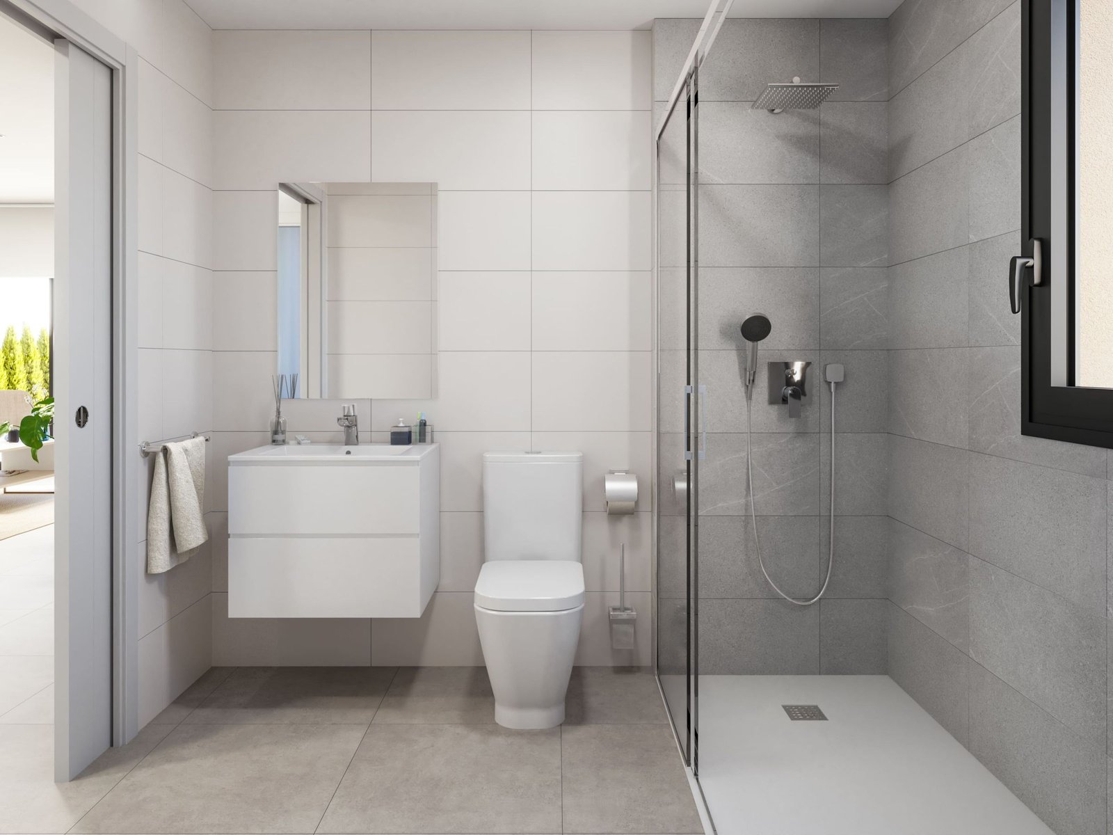Badkamer met wastafelmeubel, toilet en inloopdouche achter een glazen wand.