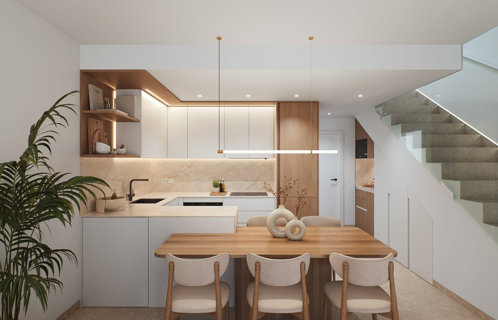Moderne keuken met kookeiland, houten eettafel en trap.