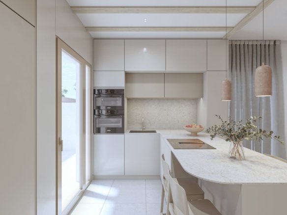 Moderne keuken met kookeiland, eettafel en glazen deur.