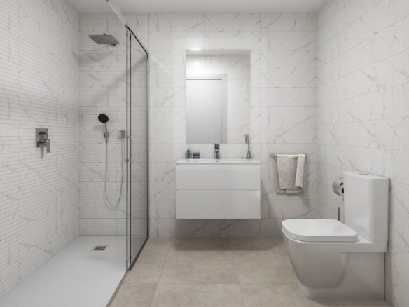 Badkamer met glazen inloopdouche, witte wastafelmeubel en toilet.