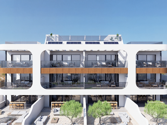Moderne appartementen met terrassen en zonnepanelen op het dak, omgeven door bomen en een tuin.