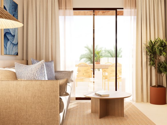 Interieur van een appartement met een moderne inrichting, bank, salontafel en open toegang naar een terras.